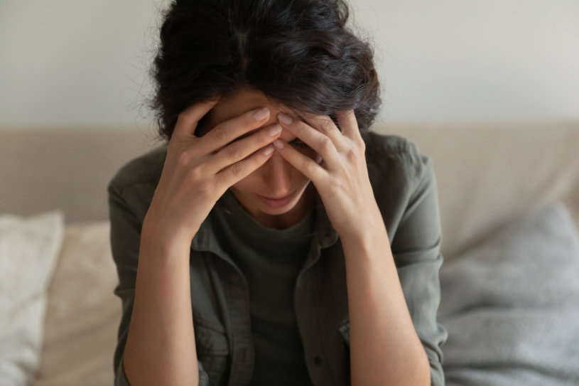 A woman experiencing headache after barbiturates use.