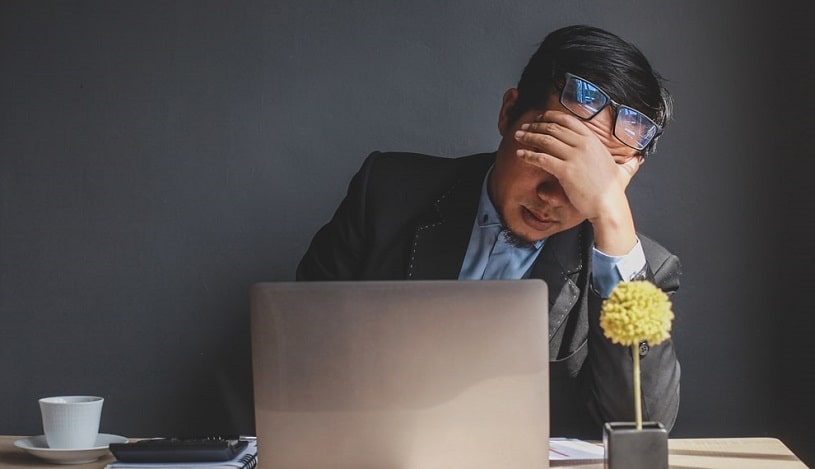 Man feeling bad after drinking coffee.