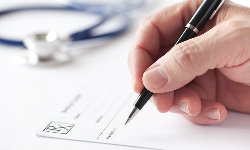 Doctor writing a prescription for Cymbalta.