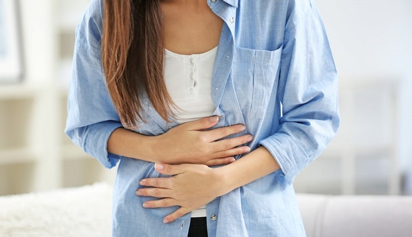 Woman experiencing nausea due to Cymbalta withdrawal.