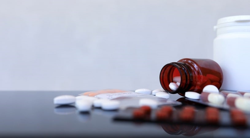 Different opioid pills on the table.
