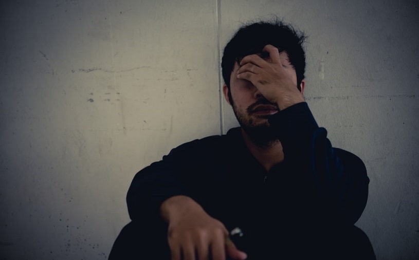 Depressed man suffering from Halcion addiction.
