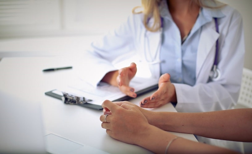 Doctor consulting a patient about methadone detox.