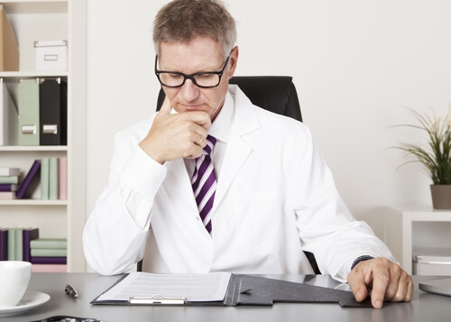 Doctor Reading Clients Medical Results 