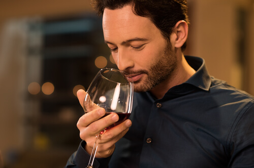 man drinking red wine