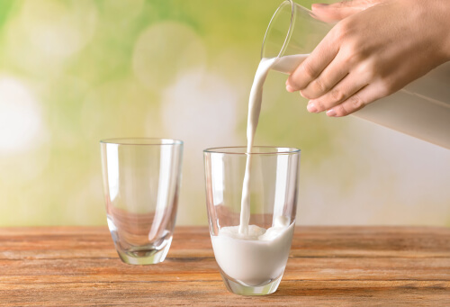 pouring milk in a glass