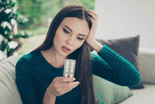 woman needs Painkillers For Headache 
