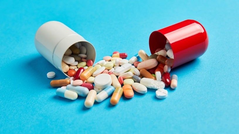 Colorful medicines drugs in large capsule