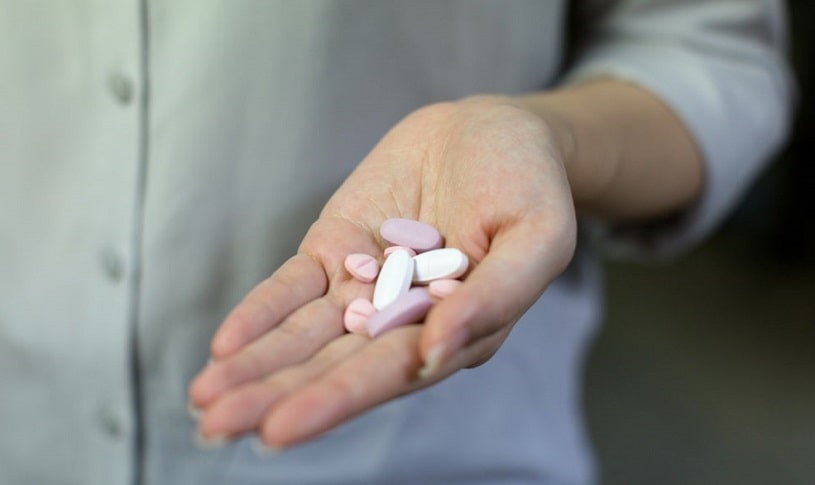 Aleve pills in the hand.