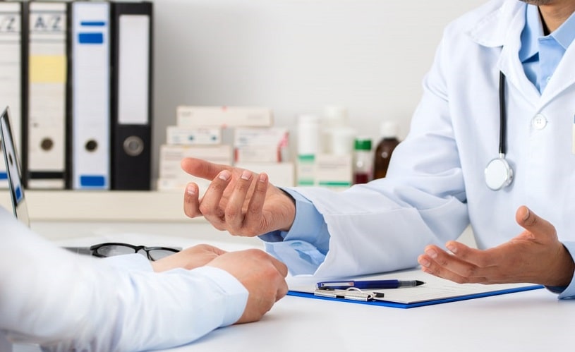 Doctor explaining something to the patient.