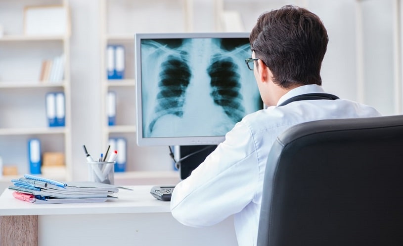 Doctor checking patien's x-ray on the computer.