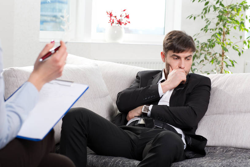 Businessman with addiction problem during counseling session.